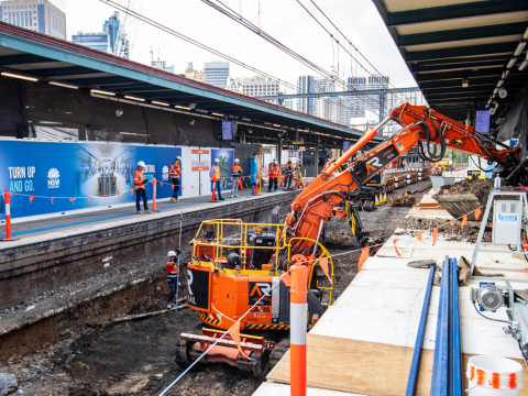 Heavy machinery is being used to reinforce the railway track which is above the future central walk.