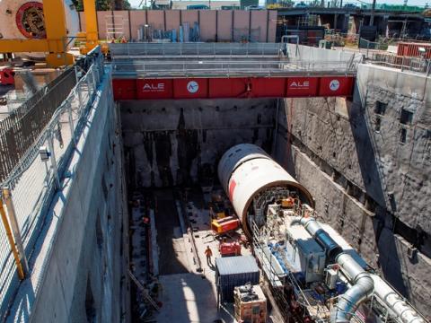 An above the ground view looking down at tunnel boring machine beginning work at Sydney Metro's Marrickville Station. 