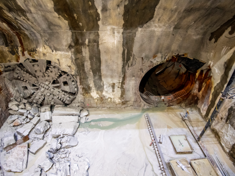 An aerial view into the cavern where two TBMs (tunnel boring machines) have broken through the cavern wall to make way for train tunnels.