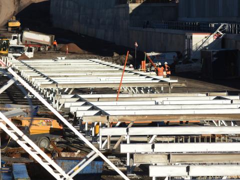 Steel beams being reinforced above the concrete platform canopy at Sydney Metro's Cudgegong Road Station. 