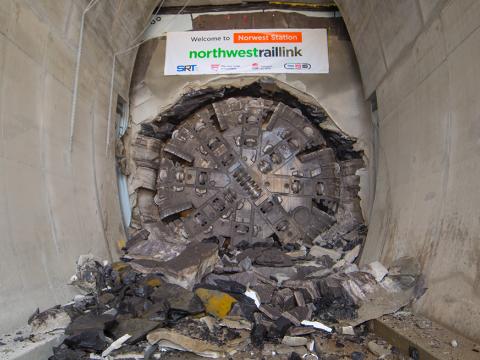 An on the ground view showing Tunnel Boring Machine (TBM) 1 Elizabeth final break through the stone at Sydney Metro's Hills Norwest Station as part of the North West Rail Link project. 