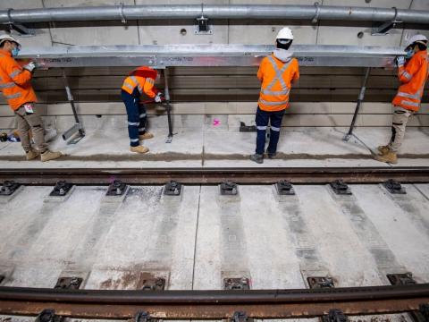 A safety walkway is installed inside the Sydney Metro tunnels just north of the Blues Point access shaft. 