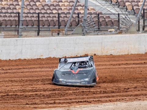 A race car drives in the dirt track at the new Eastern Creek Speedway.
