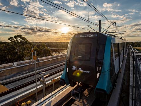Sydney Metro train on the tracks arriving at Sydney Metro's Kellyville Station.
