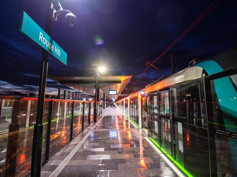 Sydney Metro train at the platform at Sydney Metro's Rouse Hill Station at night. 