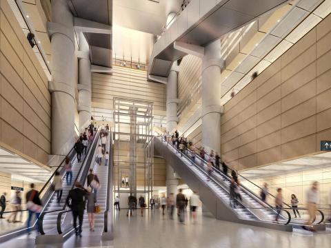Customers using two escalators inside building atrium