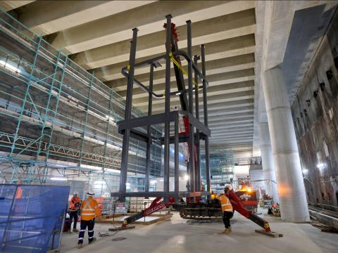Steel structure craned into position down into the station box on Sydney Metro's new station at Barangaroo.