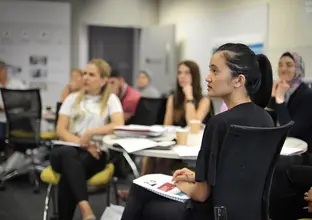 Teachers at Western Sydney University listening to a talk about the Sydney Metro West project.