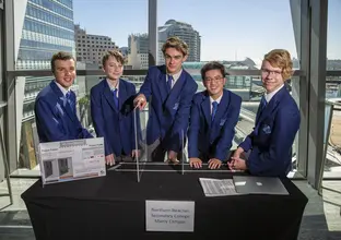 Students from Northern Beaches Secondary College stand with their submission into the 2018 Sydney Metro Minds STEAM Challenge competition.