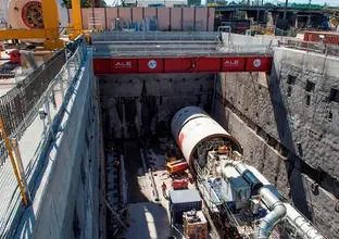 An above the ground view looking down at tunnel boring machine beginning work at Sydney Metro's Marrickville Station.