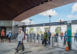 A group of community members commuting inside the station entrance of Sydney Metro's Tallawong Station as part of the community day event.