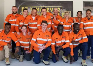A group of 13 graduates from TAFE pictured wearing PPE.