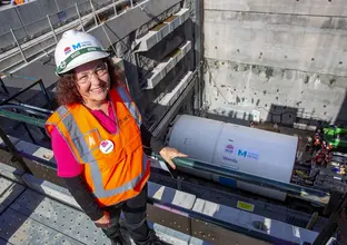 An arial shot looking down at Wendy Schreiber, a volunteer at Bear Cottage after whom our mega tunnel boring machine Wendy is named after below you can see Tunnel Boring Machine Wendy as it begins work at Chatswood Drive.