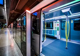 An artist's impression showing a close up of the Sydney Metro train's interior as it has stopped at North Ride Station platform.
