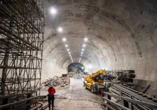 A construction worker looks down the tunnel site of Victoria Cross Station.