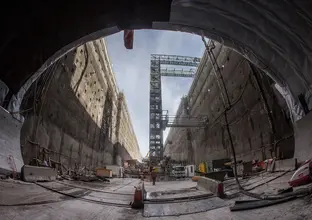 An on the ground view using a fisheye lens to give an indisde perspective of a view inside the cross-over cavern construction at Sydney Metro's Castle Hill.