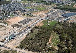 A bird's eye view sowing the construction of Sydney Metro's Tallawong Station, construction site, trains facility and surrounding suburbs.