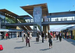 Artist's impression of the platforms at the new Sydenham Station. People are walking into the metro train through the platform screen doors. A pedestrian bridge is above.