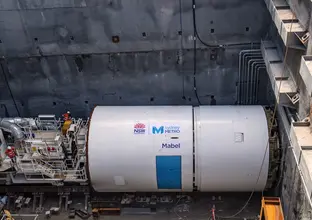 An arial view looking down at Tunnel Boring Machine Mabel in place at a Sydney Metro construction site.