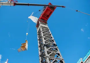 Metal structure being lifted by a crane at Sydney Metro's Crows Nest Station.