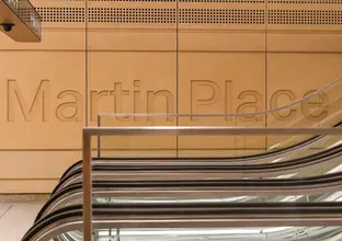 The words Martin Place indented on a wall at the station