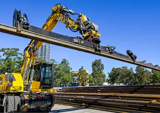Machinery moving rail steel at Sydney Olympic Park