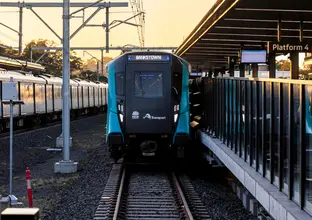 Train destined for Bankstown sitting at Sydney Metro station platform