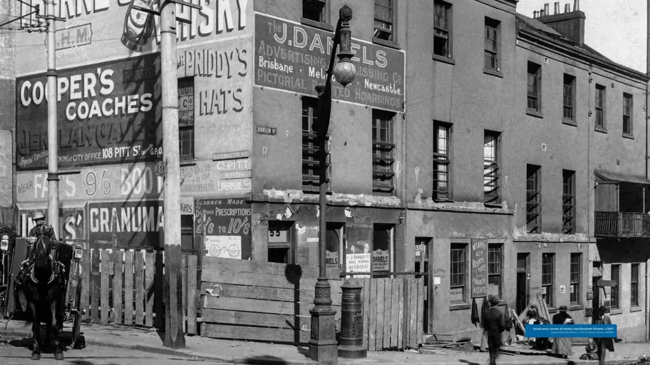 Black and white photo of a building on the South-west corner of Hunter and Elizabeth Streets