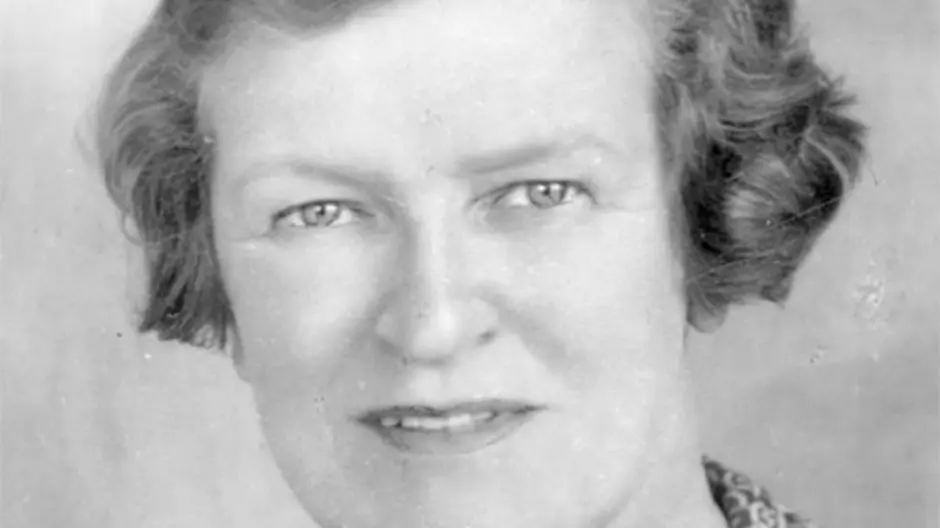 Jessie street in short hair wearing a printed shirt in black and white photograph
