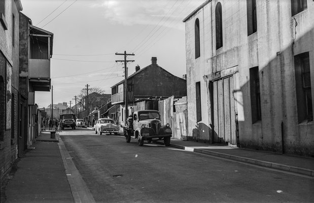 Black and white photo of an old car parked on Wellington Street in 1961.