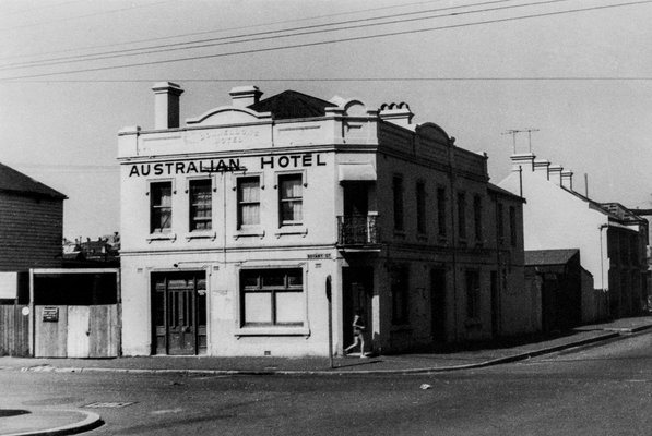 Black and white photo of the Australian Hotel on the corner.