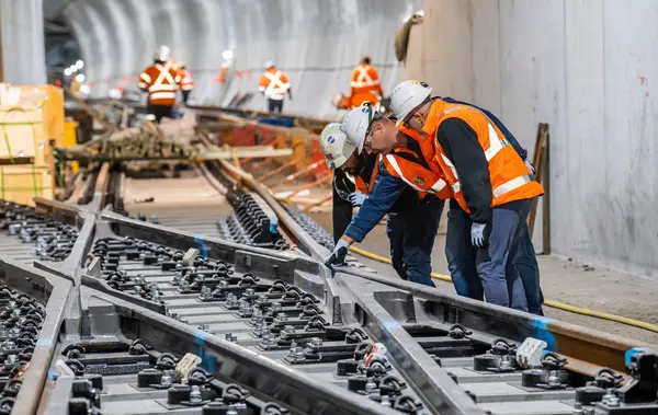 Sydney Metro staff inspecting rail tracks