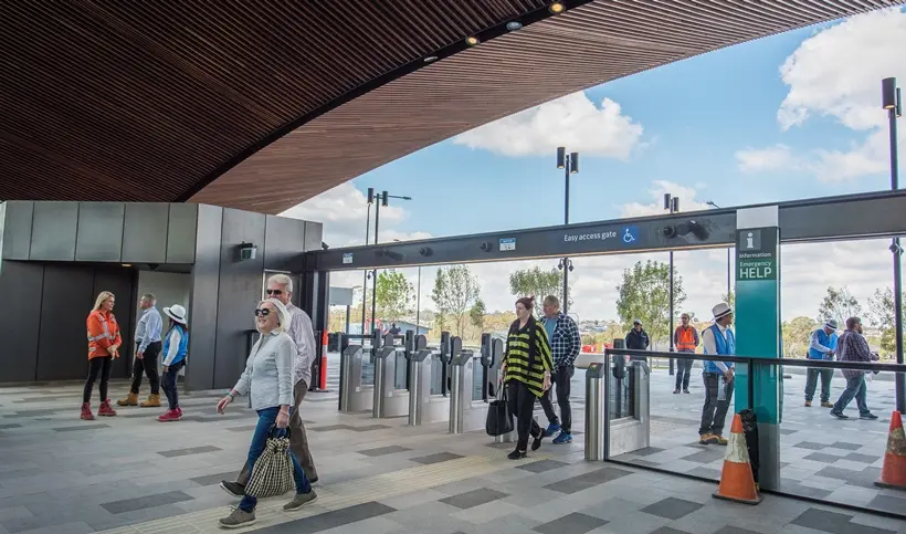 A group of community members commuting inside the station entrance of Sydney Metro's Tallawong Station as part of the community day event.