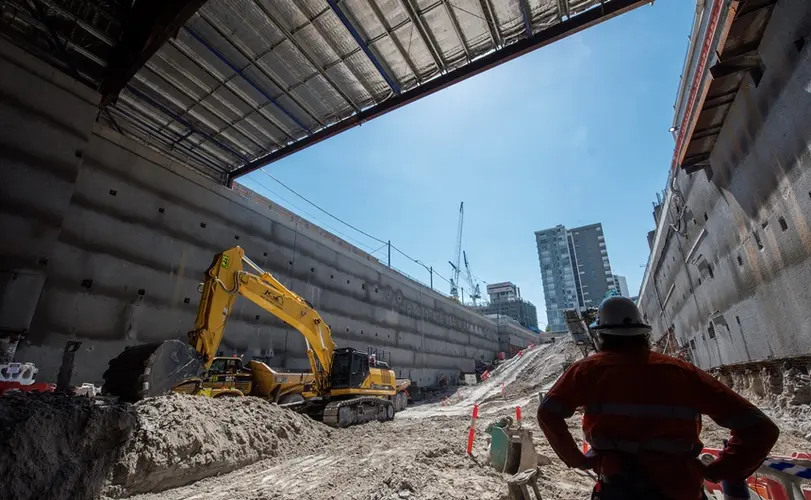 An on the ground shot as a construction worker is inspecting the excavation work at Sydney Metro's Crows Nest Station.