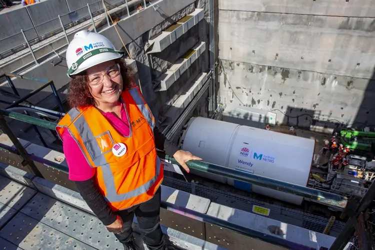 An arial shot looking down at Wendy Schreiber, a volunteer at Bear Cottage after whom our mega tunnel boring machine Wendy is named after below you can see Tunnel Boring Machine Wendy as it begins work at Chatswood Drive.