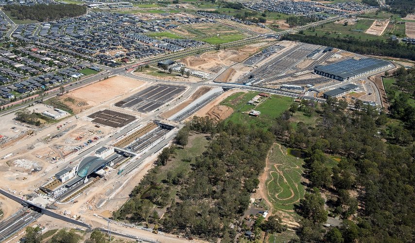 A bird's eye view sowing the construction of Sydney Metro's Tallawong Station, construction site, trains facility and surrounding suburbs. 