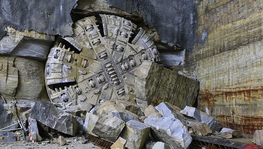 An on the ground view showing Tunnel Boring Machine (TBM) 2 Florence final break through the stone at Sydney Metro's Hills Showground Station.