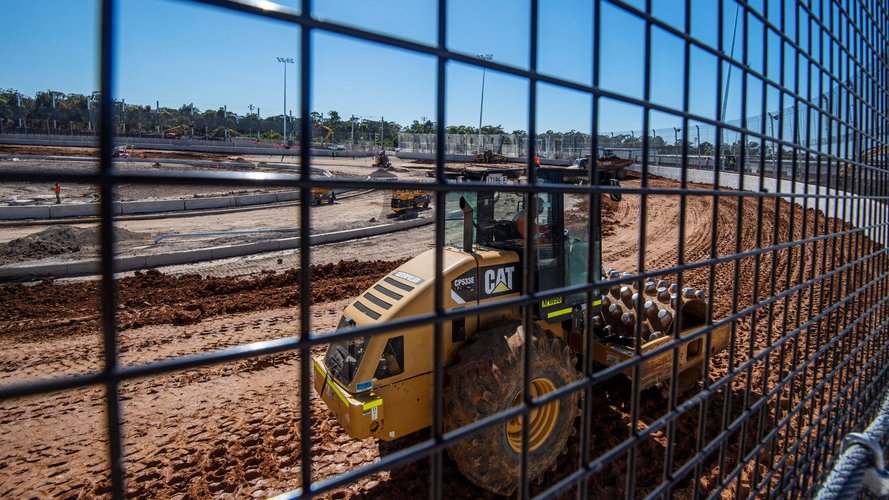 A view from the other side of the fencing at the construction site of the Sydney International Speedway.