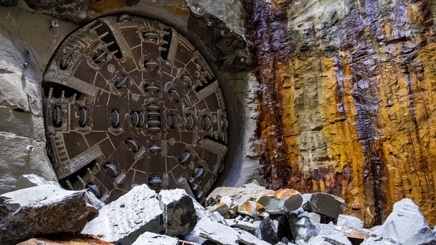 An on the ground view of Tunnel Boring Machine (TBM) Mabel breaking through at Blues Point tunnel access site on the edge of Sydney Harbour.