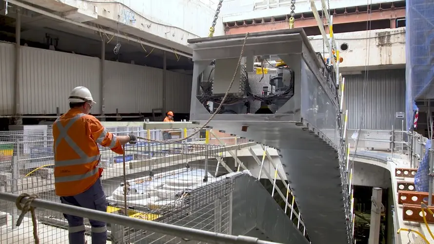 Construction worker installing an escalator at Central Station