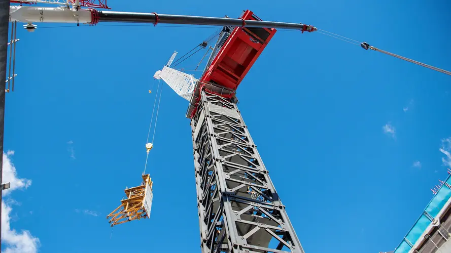 Metal structure being lifted by a crane at Sydney Metro's Crows Nest Station.