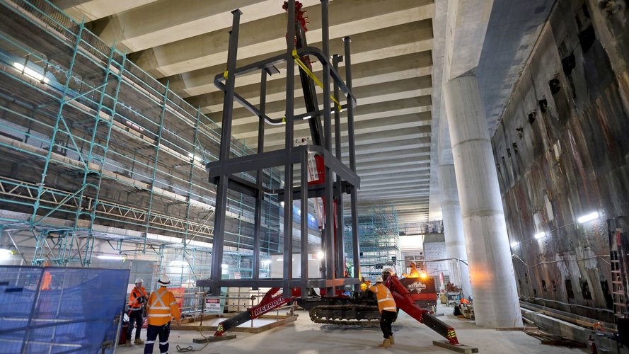 Steel structure craned into position down into the station box on Sydney Metro's new station at Barangaroo.