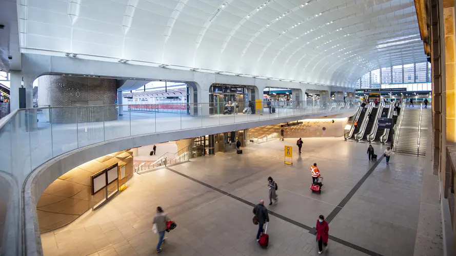 People walking in the brightly lit North South Concourse of Central Station