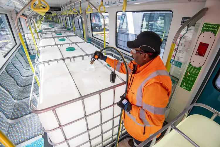 Passenger simulation testing by a worker in bright orange PPE on the Sydney Metro City & Southwest line