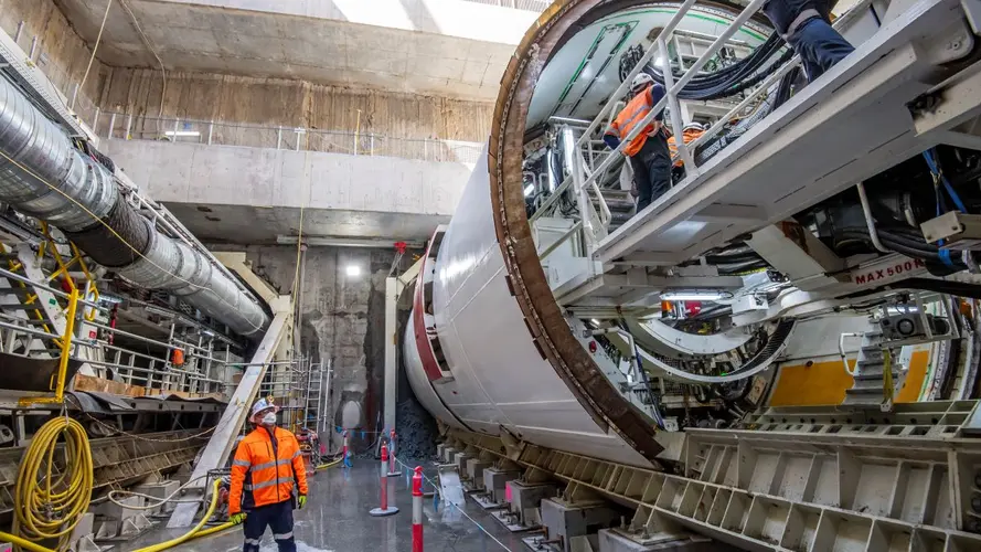A worker checking the TBM machine from outside