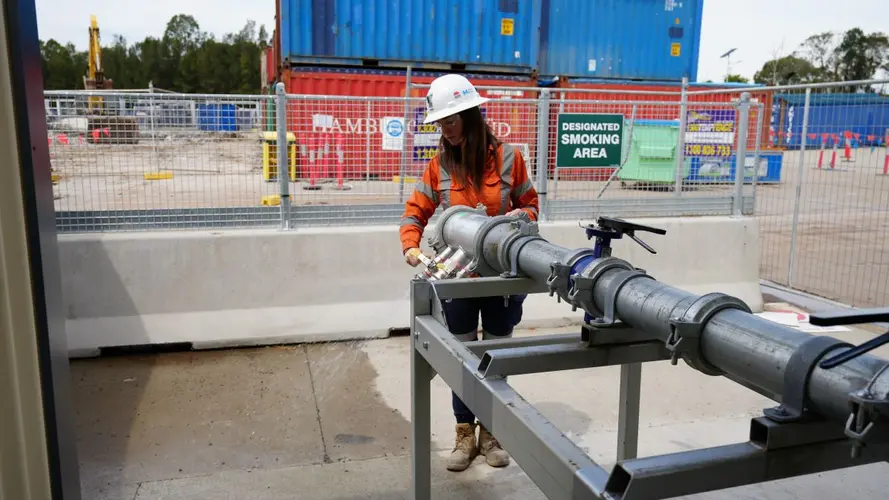 One apprentice working at the construction site wearing PPE 