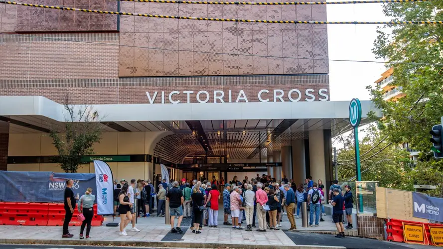 People gathering at the opening of the Victoria Cross station