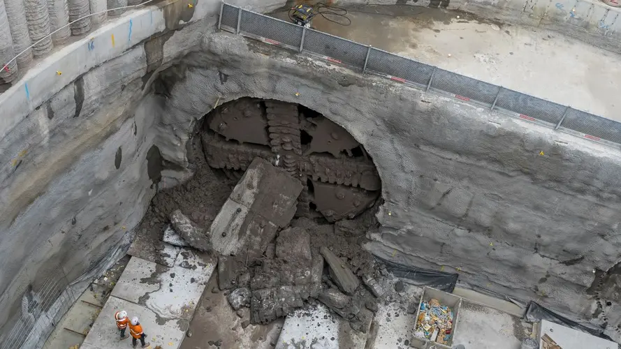 TBM breaking through with two spectators