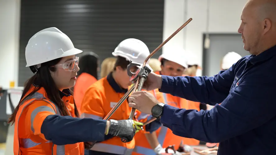 women are working at the construction site workshop
