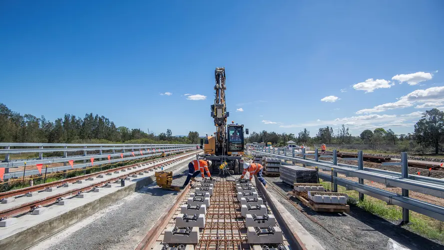 workers are laying tracks